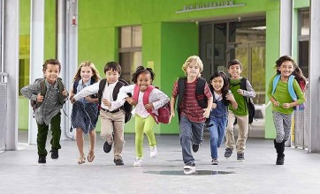 Kids running towards their healthy and clean school
