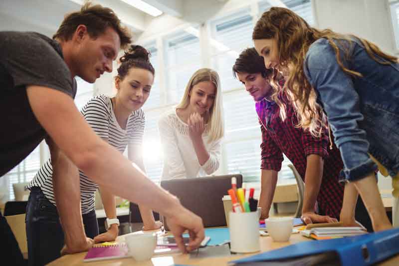 Workers in a brightly lit office