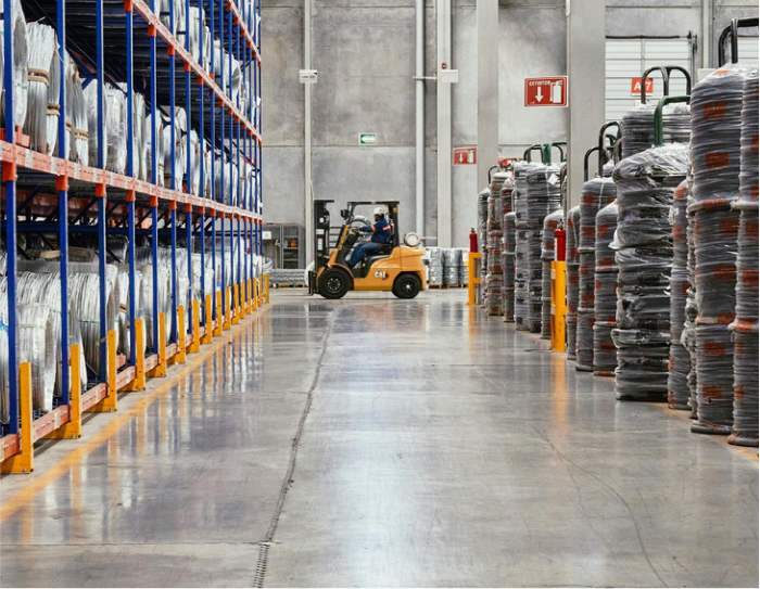 Large warehouse floor cleaned by Crewcare's industrial team